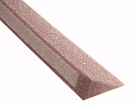 Roof valley sealing wedge